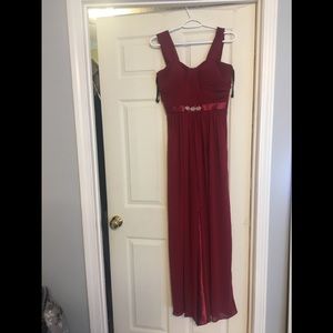 A beautiful burgundy flown prom dress!